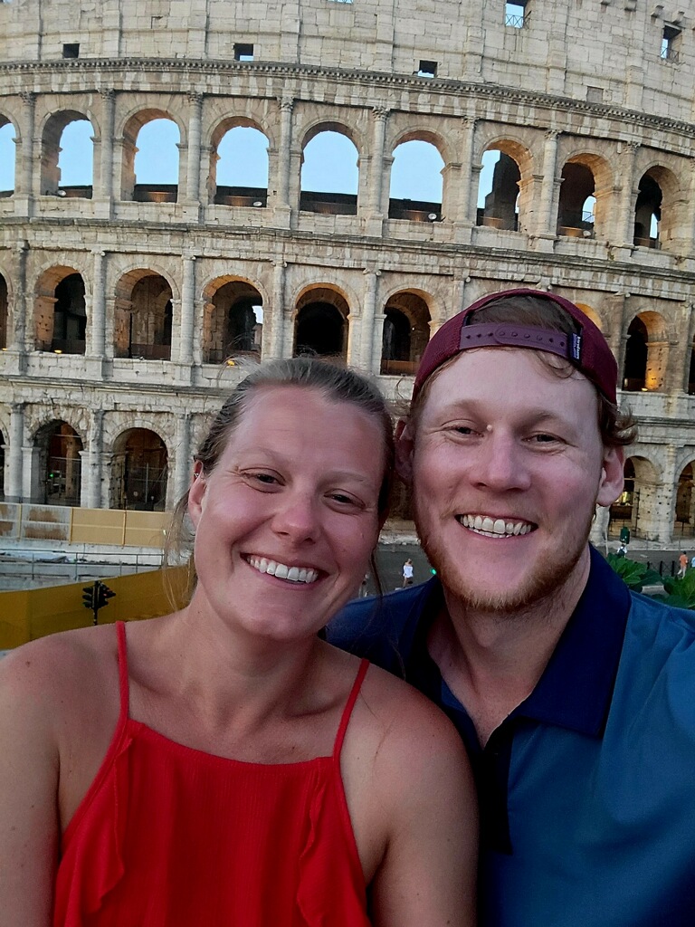 Ms. Johnson and her husband in front of the Coliseum