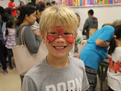 Boy with red face paint