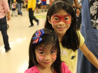 Two sisters with painted faces