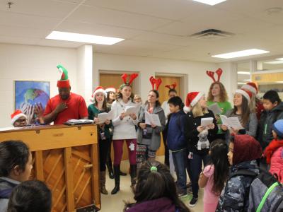 On another day, Mr. Jackson leads the carolers.