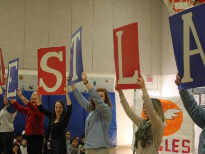 Teachers hold "Westla" signs