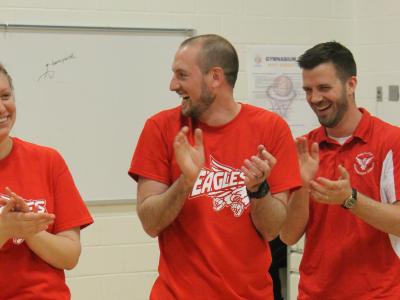 2 male teachers laugh as Mr. Jackson gives out funny nick names to each player