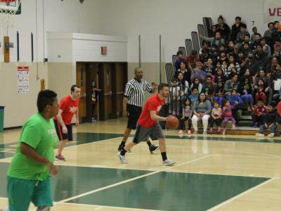 Mr. Reed dribbles down the court
