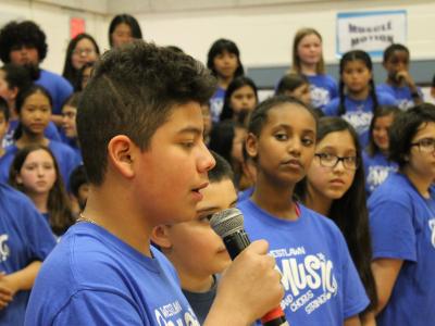 Male 6th grader with microphone