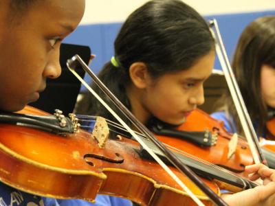 Two Grade 6 girls play violins