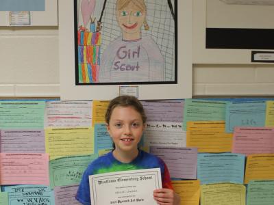 young girl with certificate