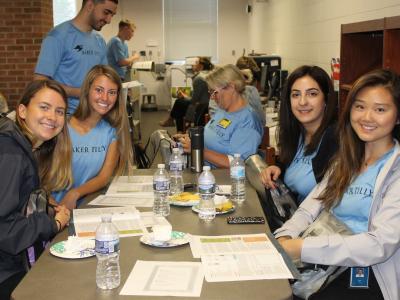 Volunteers sitting at table during breakfast