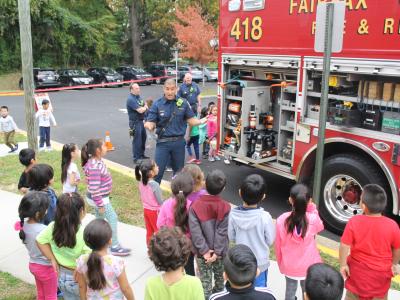 Firefighter talking to students