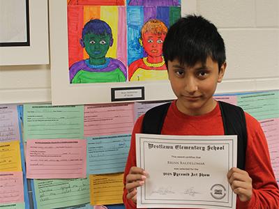 Grade 6 boy with award