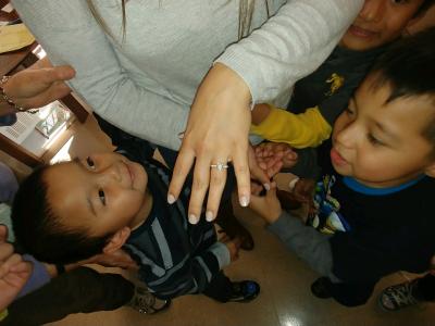 Showing students her ring
